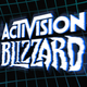 An Activision Blizzard logo hangs in front of a futuristic grid background.